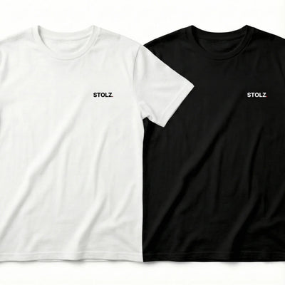 Two loose-fitting short-sleeve t-shirts, one white and one black, both with 'STOLZ' text on the chest.