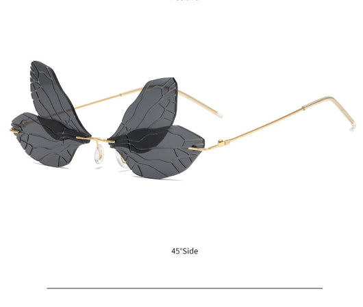 Light green rimless butterfly sunglasses with gold metal frames, featuring a unique veined lens design. - Image 19