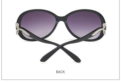 Brown oversized butterfly sunglasses with gradient lenses and a silver-tone floral accent on the temple. - Image 13