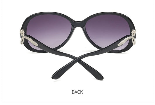 Brown oversized butterfly sunglasses with gradient lenses and a silver-tone floral accent on the temple. - Image 13