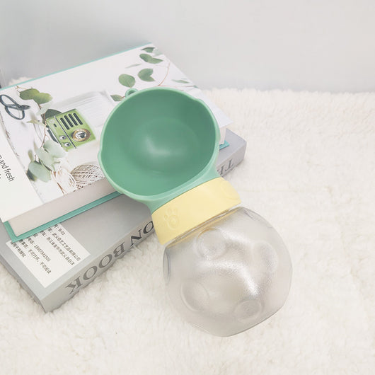 Portable pet water bottle with white drinking bowl, translucent grey reservoir, and yellow paw print band. - Image 4