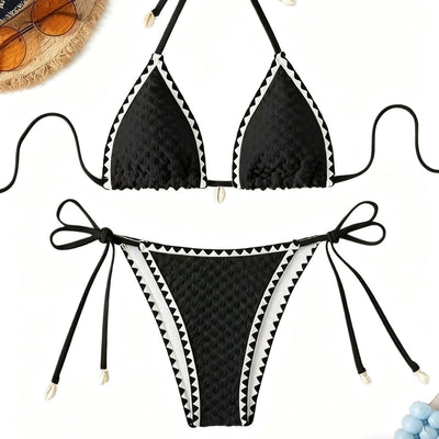 Black textured bikini with white scalloped trim, halter top, and tie-side bottoms featuring small shell details. - Image 5