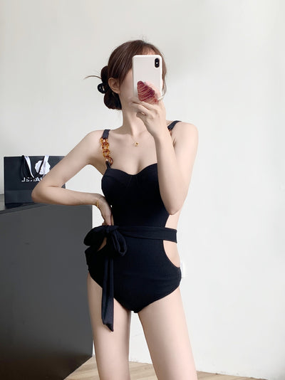 Black ribbed one-piece swimsuit with sweetheart neckline, chain-link shoulder strap, side cut-outs, and self-tie waist. - Image 16