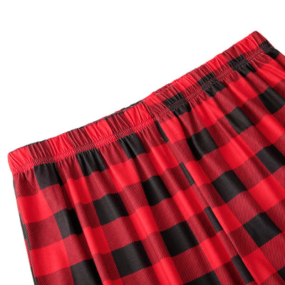 Baby in a red and black buffalo plaid long-sleeve pajama romper, viewed from the back with arms raised. - Image 10