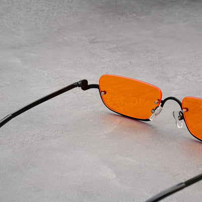 Gold frame semi-rimless sunglasses with brown rectangular lenses and black temple tips on a white background. - Image 19