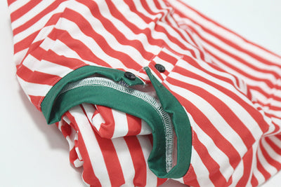 Family of six wearing matching red and white striped long-sleeved pajamas with green cuffs and festive hats. - Image 25
