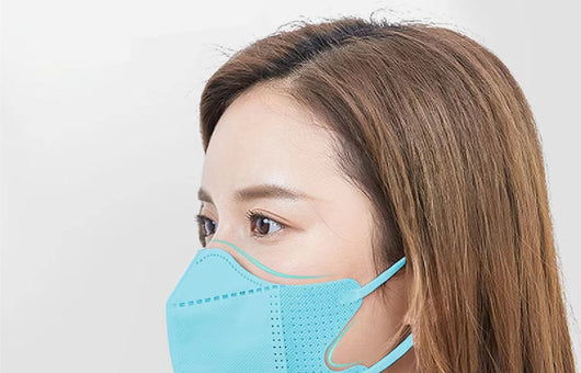 Peach disposable 3-layer face mask with perforated details worn by a person, offering comfortable daily protection. - Image 32
