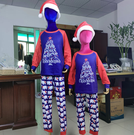 Family matching Christmas pajamas with blue long-sleeve tops, red raglan sleeves, and a Christmas tree graphic. Blue pants feature a white polar bear pattern. - Image 6