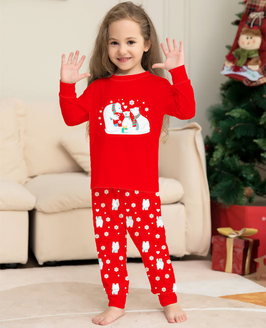 Young child wearing a red two-piece pajama set with a polar bear family graphic and snowflake print. - Image 12