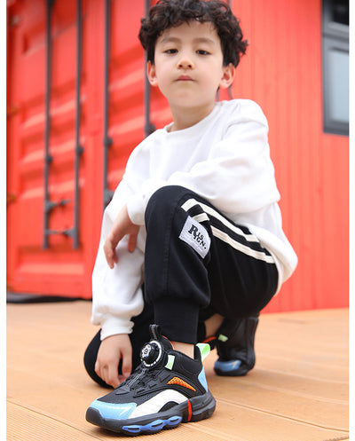 Black, white, and neon green children's basketball shoes with rotating buckle closure, featuring a mid-top design. - Image 17