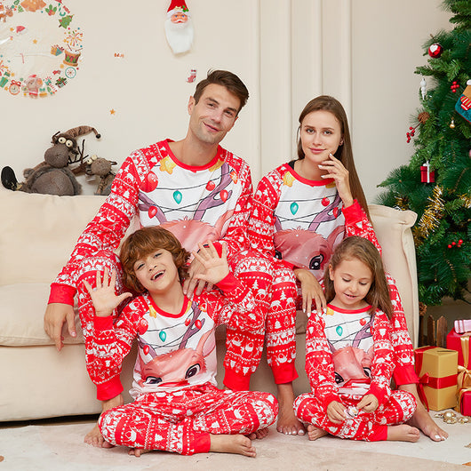 Man wearing a red and white Christmas pajama set with a reindeer graphic and fair isle pattern. - Image 9