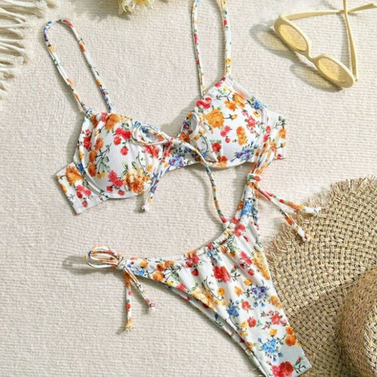 Women's white floral two-piece bikini with red, orange, and blue flowers, featuring a tie-front top and tie-side bottoms. - Image 3