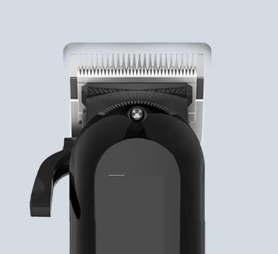 Black electric hair clipper with LCD display showing '100', multiple guide combs, cleaning brush, oil, comb, and USB cable. - Image 5