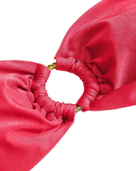 Red glitter bandeau bikini with gold-tone O-rings and side-tie bottoms on a model in a sunny outdoor setting. - Image 86