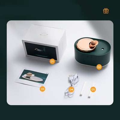 Dark green and rose gold rotating planet humidifier with a clear water tank and a wooden planet-like top. - Image 7