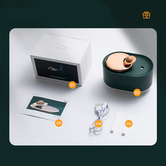 Dark green and rose gold rotating planet humidifier with a clear water tank and a wooden planet-like top. - Image 7