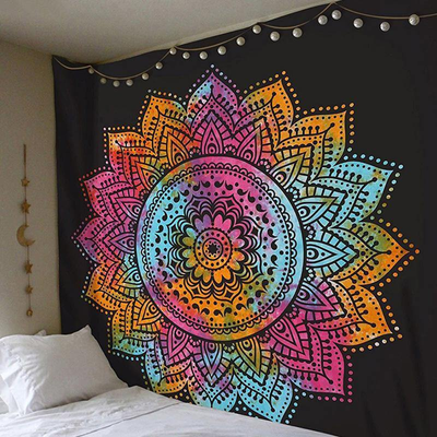 Vibrant mandala tapestry with a rainbow of colors on a black background, adorned with string lights, hanging above a bed. - Image 2