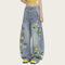 Jeans Curve con Bordado Floral y Botánico