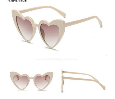 White heart-shaped sunglasses with dark gray lenses, shown from front, top, and side views on a white background. - Image 5