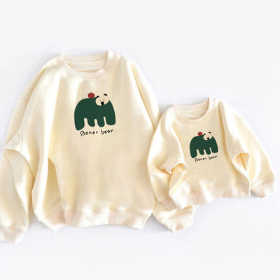 Matching cream crew neck sweatshirts, one adult and one child size, with a dark green bear graphic and "Boner bear" text. - Image 13