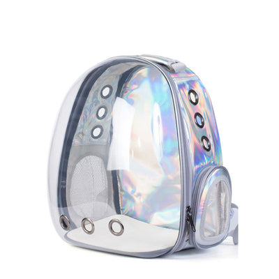Dark grey transparent pet carrier backpack with a white cat plush toy inside, sitting on a path outdoors. - Image 13