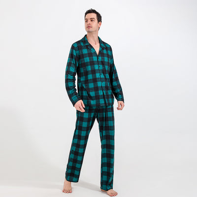 Family of four and dog wearing matching green and black plaid pajamas. Mother and father in two-piece sets, girl in dress, baby in two-piece, and dog in bandana - Image 8