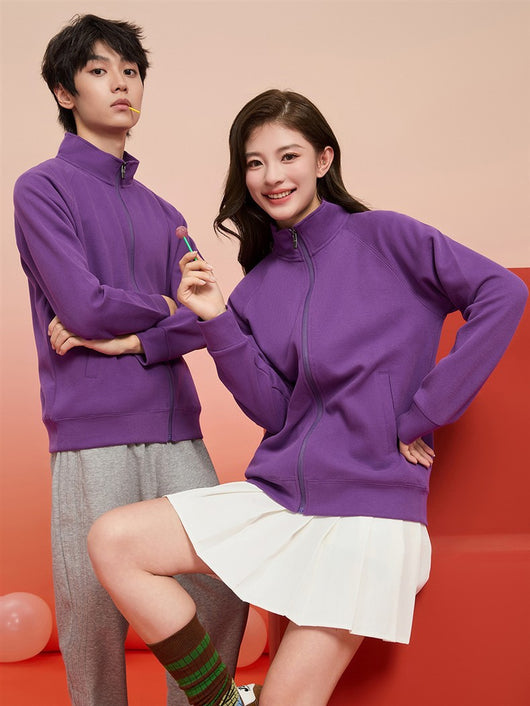 Purple full-zip jacket with a stand-up collar, raglan sleeves, and front pockets, displayed on a hanger. - Image 37