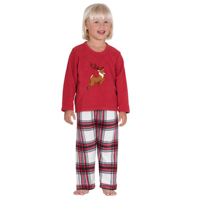 Family of five and a dog wearing matching red long-sleeve reindeer print tops and red and white plaid pajama pants. - Image 3