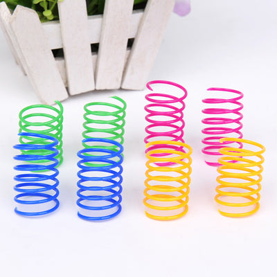 Four colorful plastic spring cat toys in green, blue, orange, and pink, packaged in a clear plastic bag. - Image 4