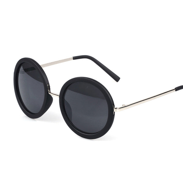 Big round sunglasses with black frames and dark lenses, featuring silver-colored temples.