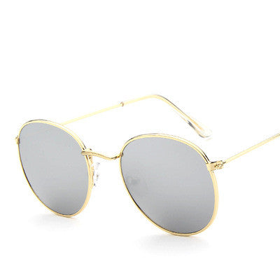 Round frame vintage sunglasses with silver metal frames and dark gray lenses on a white background. - Image 25