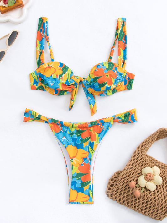 Women's colorful graphic print bikini with a bandeau top and high-cut bottom, accessorized with a gold chain. - Image 2