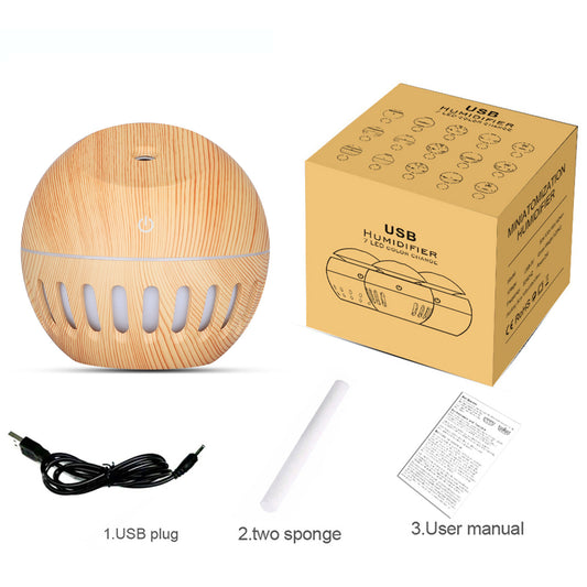 White portable home office humidifier with a spherical base, dome top, and glowing blue LED light accents.