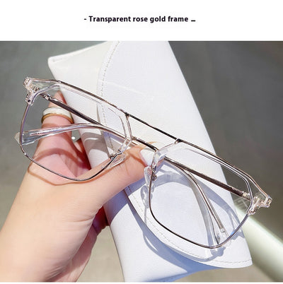 Anti-blue light glasses with a sand black and silver double beam frame, held against a white case. - Image 29
