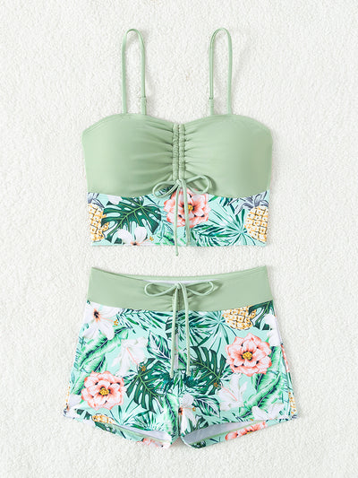 Women's light green two-piece bikini swimsuit with tropical floral and pineapple print, featuring drawstring top and shorts. - Image 9