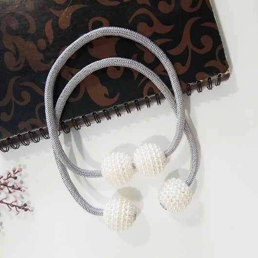 Magenta elastic curtain tieback with two white pearl-beaded spheres, designed to hold curtains elegantly. - Image 4