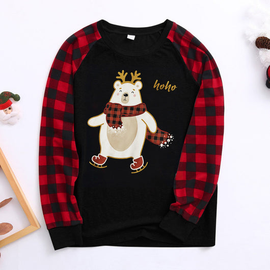 Kids' Christmas pajamas with a black long-sleeve top featuring a cartoon bear in a plaid scarf and ice skates, paired with red and black plaid pants. - Image 6