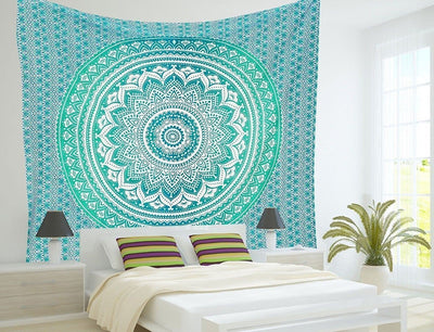 Indian Mandala tapestry with a vibrant red, orange, and yellow gradient, featuring intricate floral and geometric patterns, hanging on a wall.