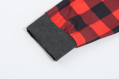 Woman wearing a Christmas pajama set with a dark gray 'Merry Christmas MOMMY' reindeer top and red and black plaid pants. - Image 15