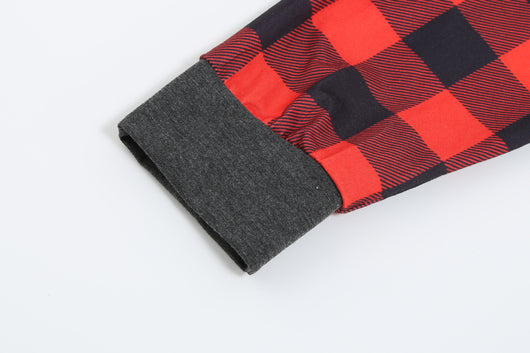 Woman wearing a Christmas pajama set with a dark gray 'Merry Christmas MOMMY' reindeer top and red and black plaid pants. - Image 15