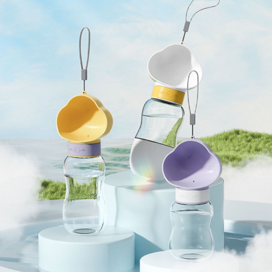 Yellow and clear portable pet water bottle with integrated drinking bowl and separate food container for walking dogs. - Image 31