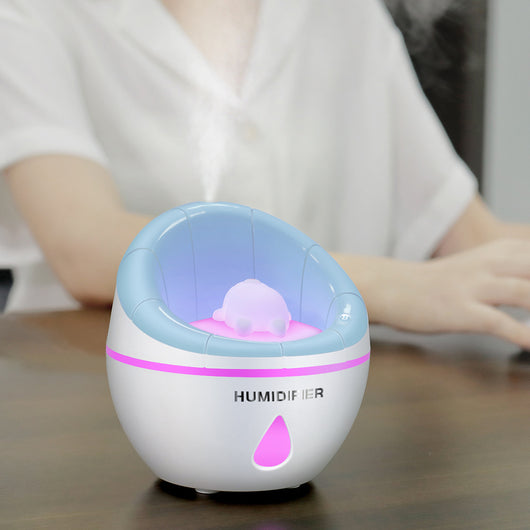 Blue and white mini humidifier with a cute white animal figure inside, suitable for car or desk. - Image 12