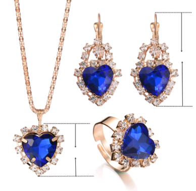 Rose gold-toned necklace, earrings, and ring set with large oval clear gemstones surrounded by smaller stones. - Image 12