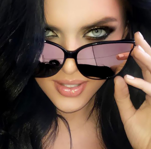 Black frame cat-eye sunglasses with vibrant pink mirrored lenses, suitable for women and fashion trends.