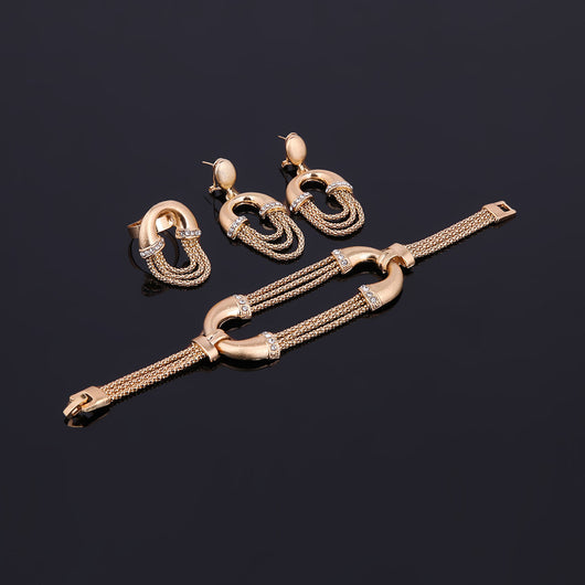 Four-piece gold-tone bridal jewelry set with crystal accents, including a statement necklace, dangling earrings, bracelet, and ring. - Image 10