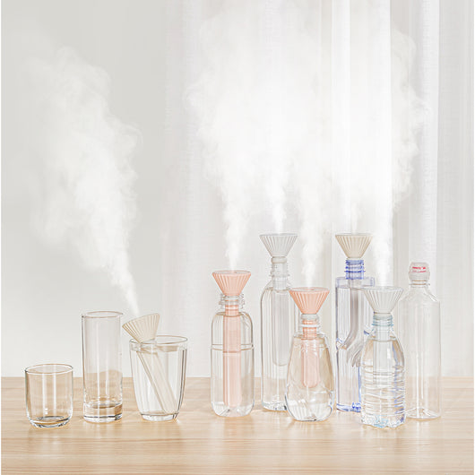 Beige and white USB ultrasonic humidifier with a fluted conical top and a cylindrical body with a water level window. - Image 9