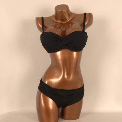 Red two-piece bikini with a twisted bandeau top and ruched low-rise bottoms, displayed on a mannequin. - Image 5