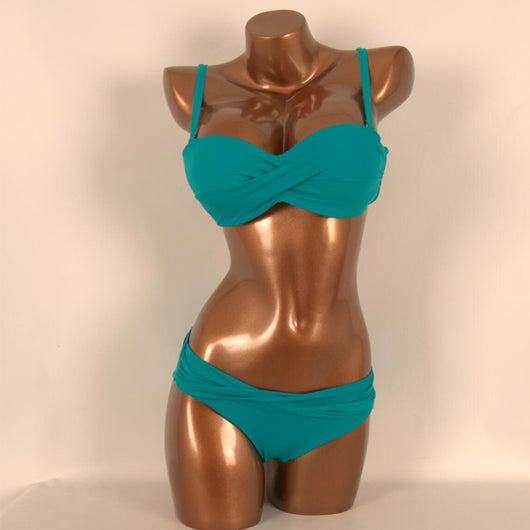 Red two-piece bikini with a twisted bandeau top and ruched low-rise bottoms, displayed on a mannequin. - Image 9