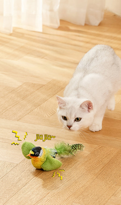 Colorful bird cat toy with green fluffy wings, black head, yellow face, orange beak, and spotted tail feathers. - Image 26