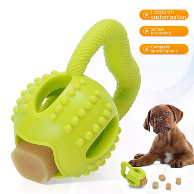 Green kettlebell-shaped TPR dog toy with a textured handle, nubs for molar cleaning, and a treat-dispensing opening.
